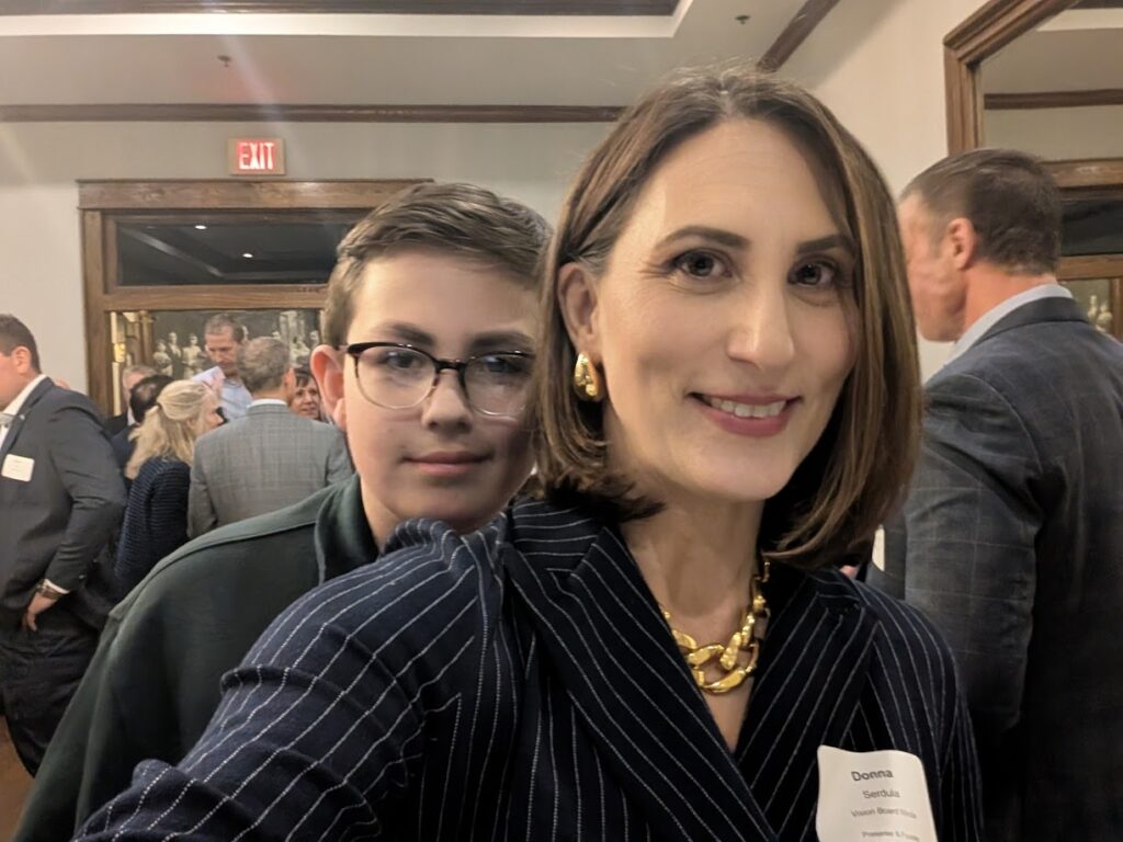 My son and me at a career branding presentation where I spoke all about personal branding for executives to take control of their careers!